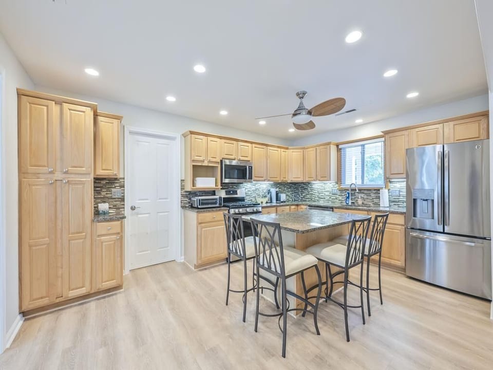 View of the open kitchen highlighting stylish finishes and ample storage space.