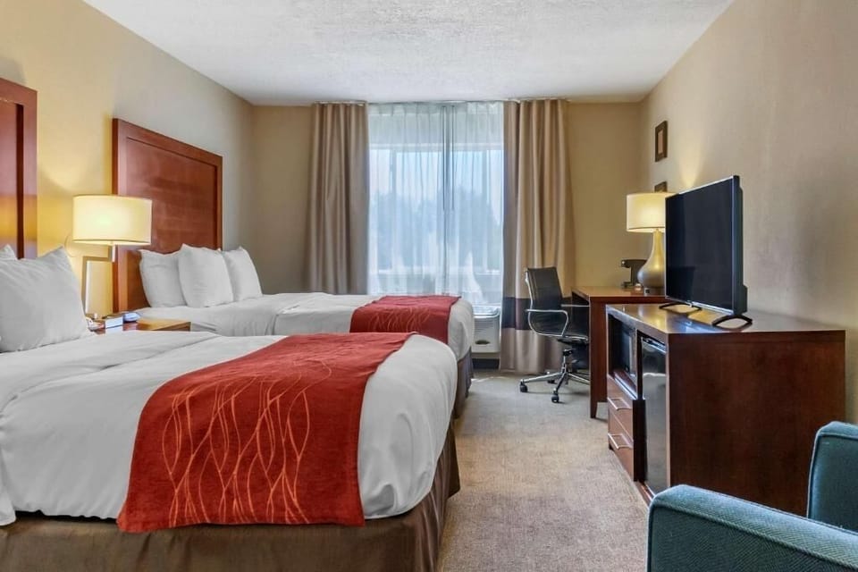 Relax in a spacious layout with work desk and TV.