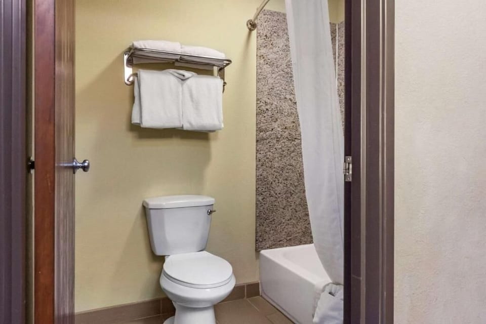 Refresh with a quick shower and neatly stocked towel shelf.