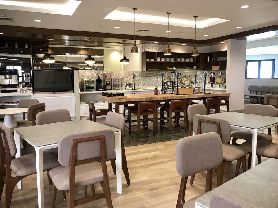 Gather for breakfast around the warm, social communal tables.