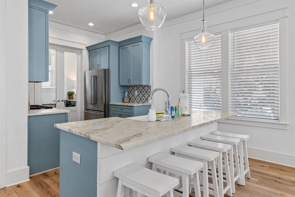 Chef-ready kitchen with marble countertops and premium appliances.