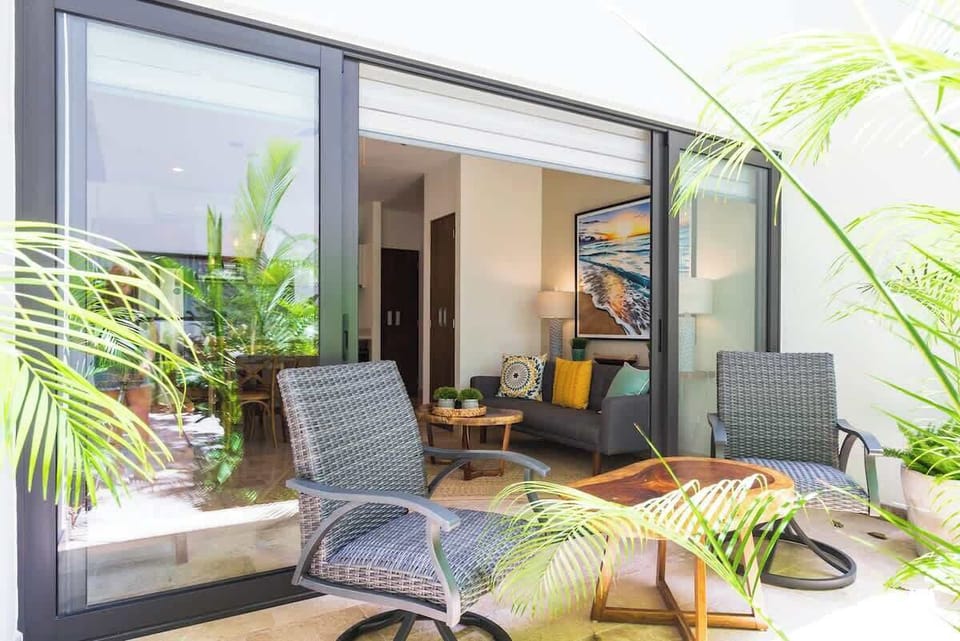 Beautiful terrace, with a sliding door that opens to the outside letting natural sunlight in.