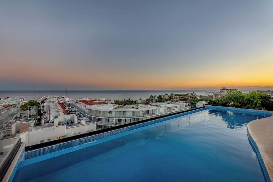 Rooftop with ocean views and sun loungers. Relax at the top!