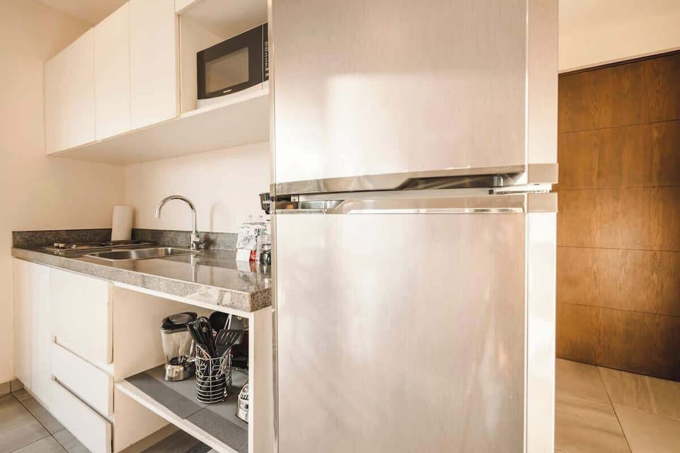 A fully equipped refrigerator is ideal for your stay.