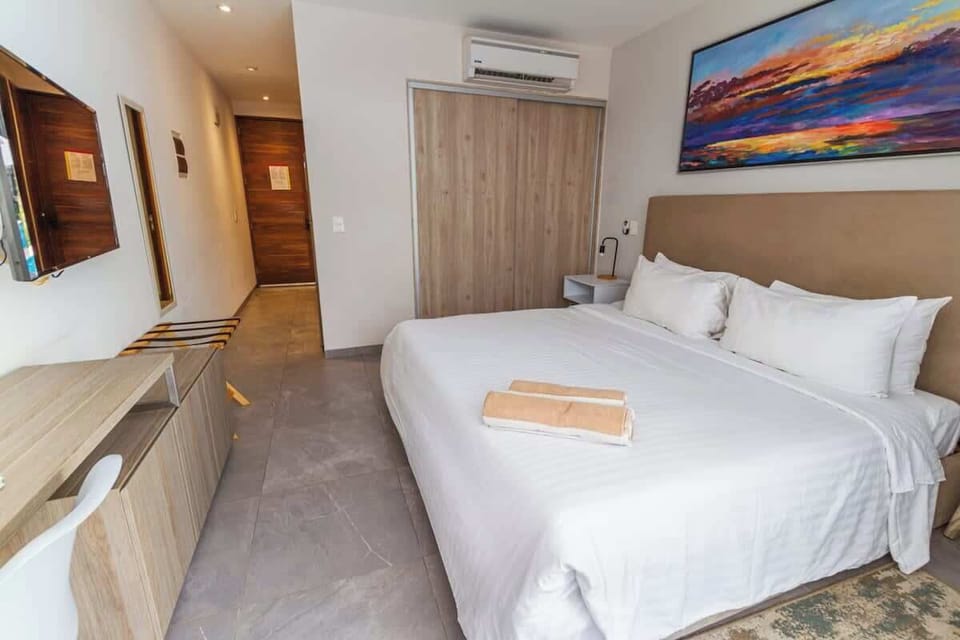 Bright & airy bedroom. Enjoy a restful stay in this inviting space.