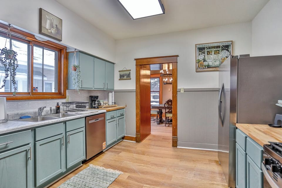 Bright, fully equipped kitchen with charming vintage details, updated appliances, and plenty of counter space.
