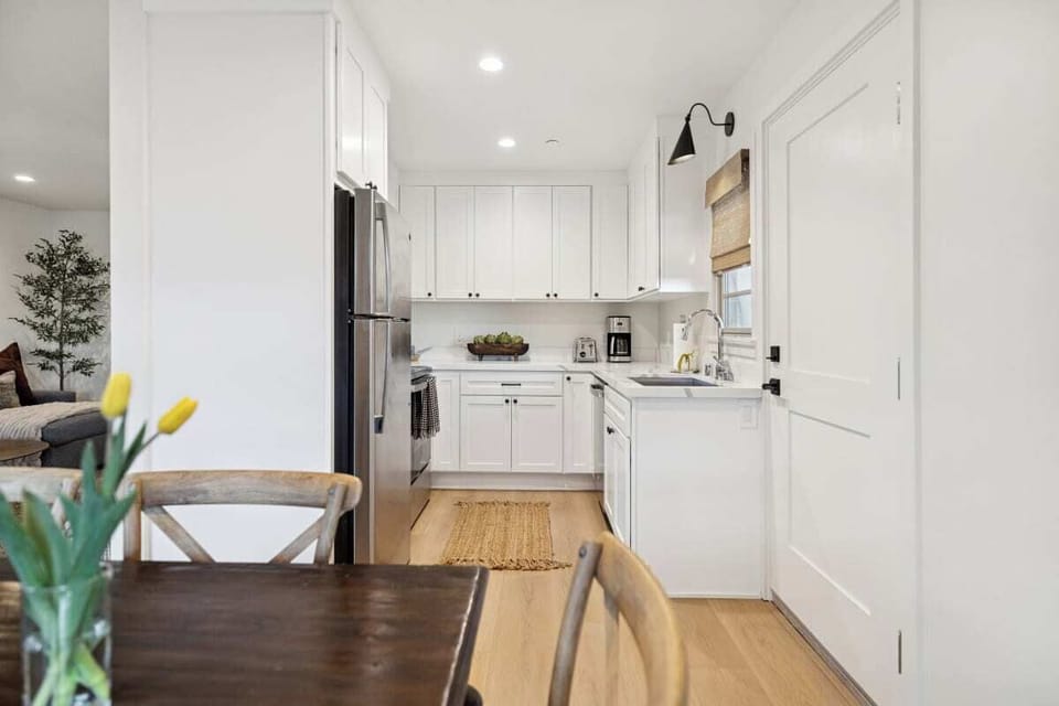 Full kitchen: Coffee drip, fridge, stove/oven, plates and utensils, dishwasher