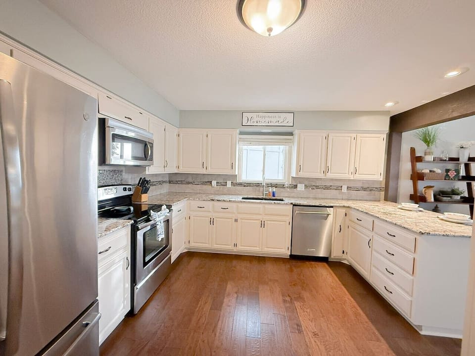 Cook and gather in this spacious, fully equipped kitchen featuring modern appliances, plenty of counter space, and bright, welcoming décor. Perfect for preparing family meals after a fun day on the lake.