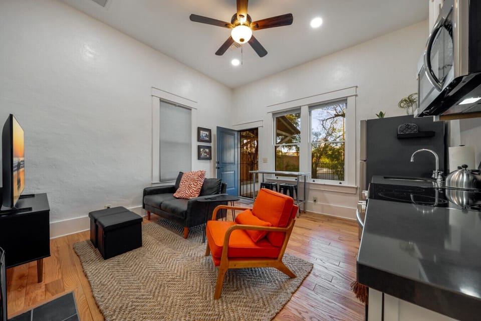 Cozy living room space with comfortable seating, smart TV, and electric fireplace