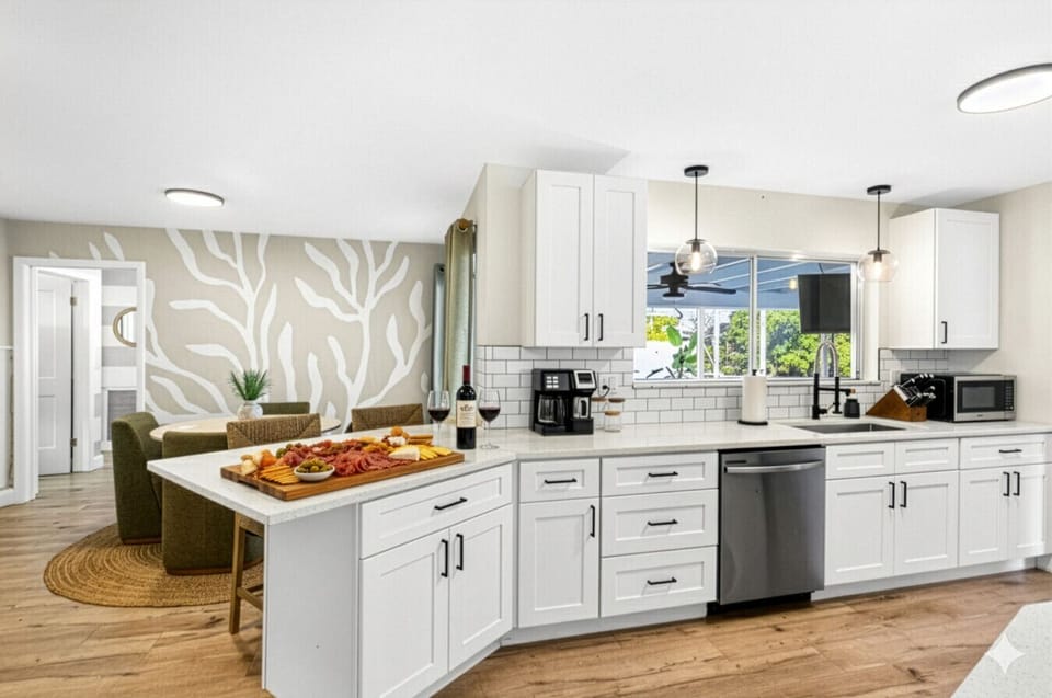 Bright, fully updated kitchen with large peninsula — perfect for gathering, cooking, and entertaining.