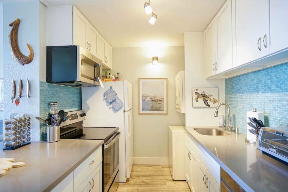 Stove, microwave, dishwasher and laundry tower