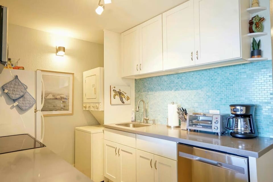 Stove, microwave, dishwasher and laundry tower