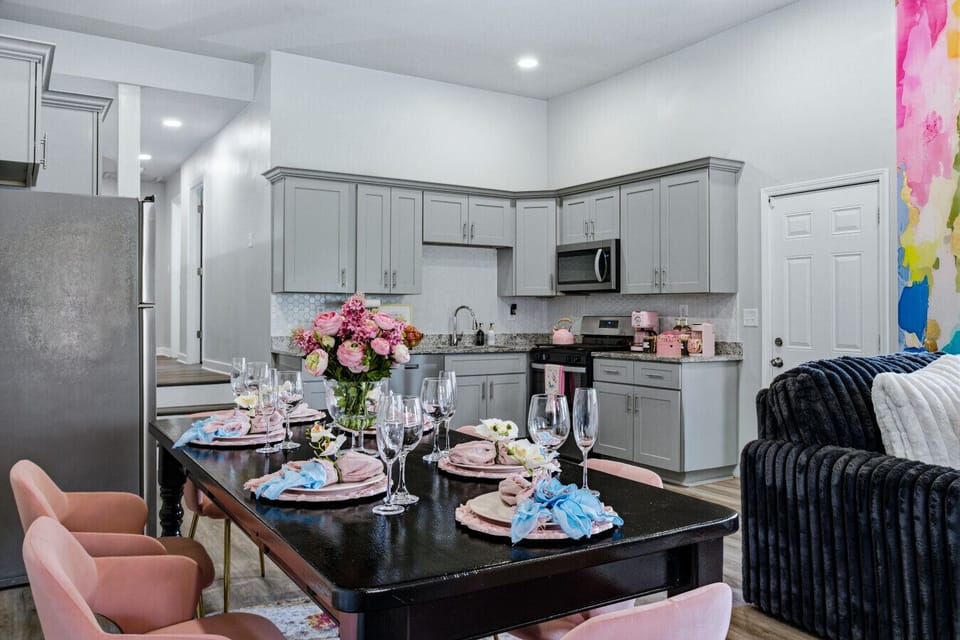 Private pink dining area with seating for 6 and elegant design