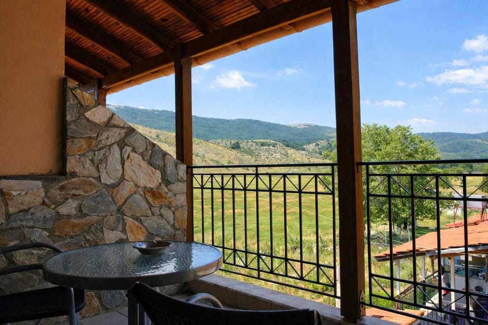 Covered Balcony with Seating and Village Outlook
Balcony area ideal for enjoying fresh air and peaceful village views.