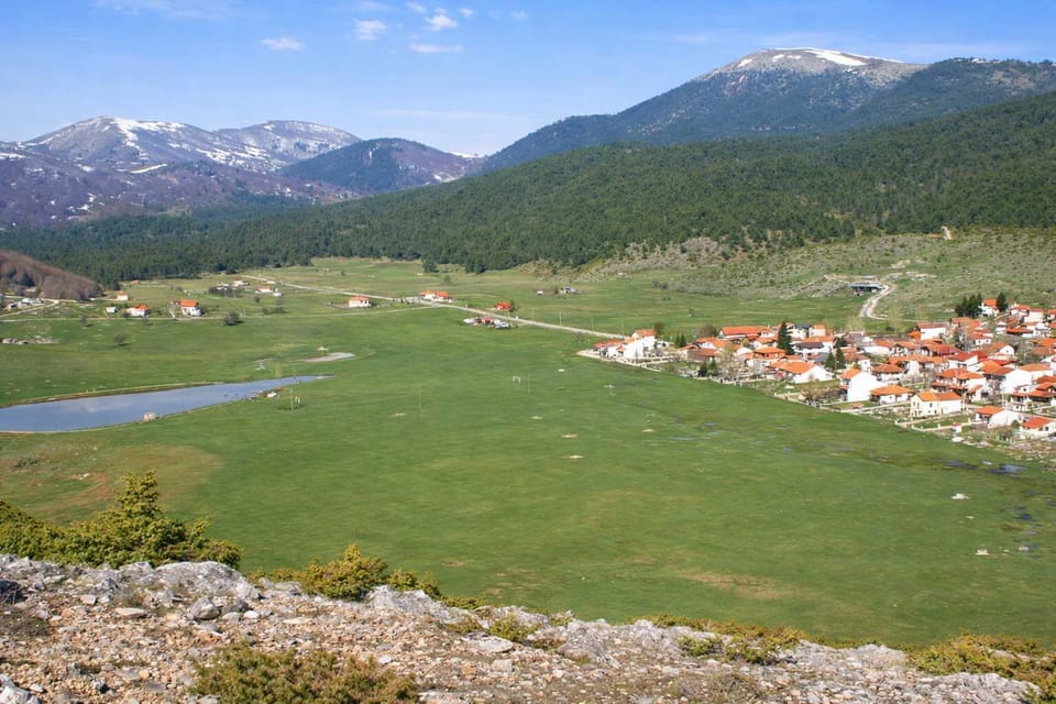 Panoramic View of Xiropigado and Open Fields
Wide view across the village, green plains, and surrounding hills.