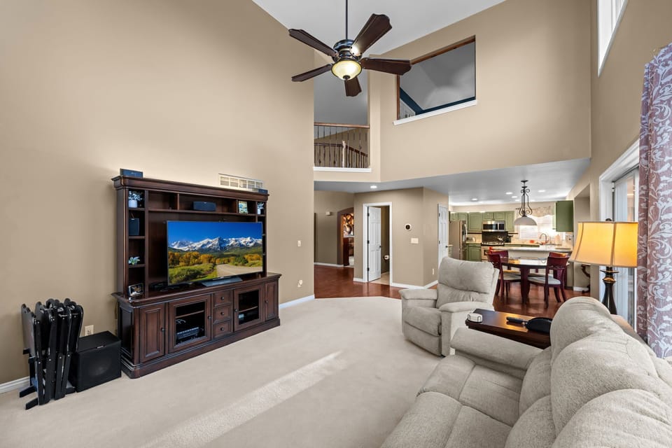 Bright, open family room with Smart TV and cozy fireplace—perfect for relaxing after exploring Parker.Additional family room in the basement with entertainment space for all ages.