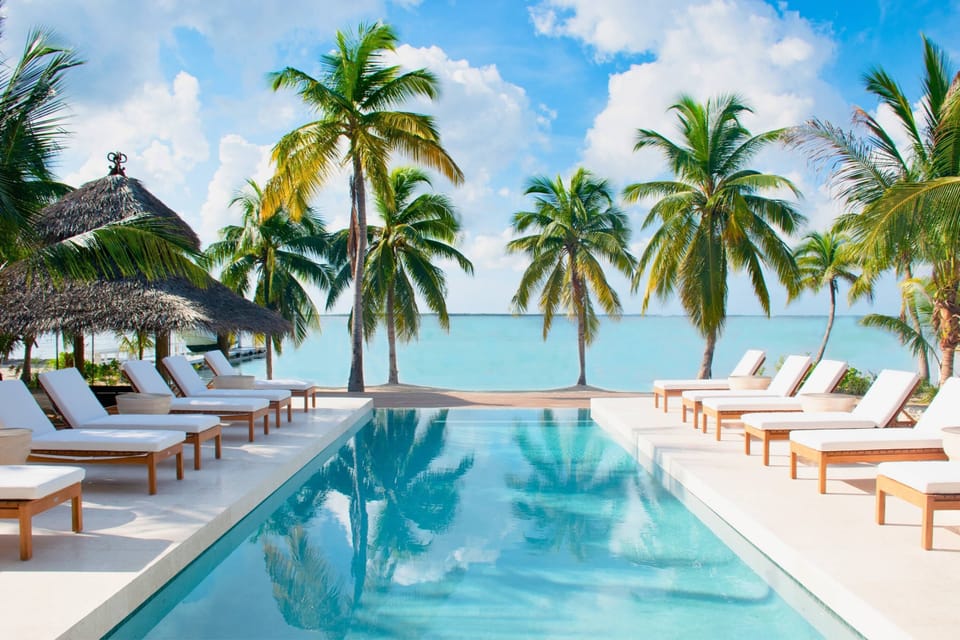Private infinity pool with plenty of sunbeds plus dazzling seaside views. 