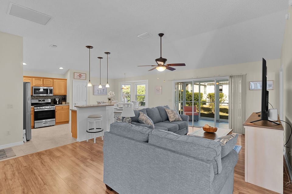 Your open-concept living space flows seamlessly from kitchen to living room, perfect for gathering and relaxing together.