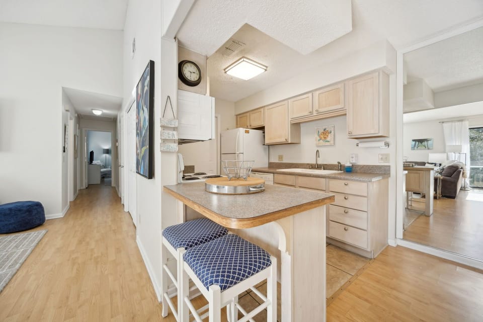 Your fully equipped kitchen features granite countertops, breakfast bar seating, and everything you need to prepare meals during your stay.