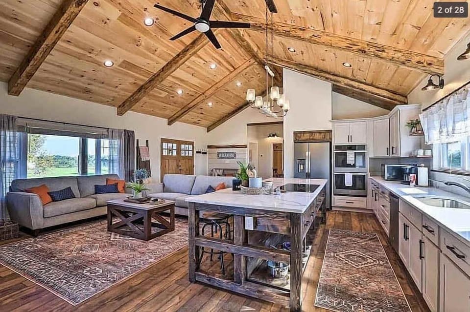Gather in this open-concept space where the living room, dining, and kitchen flow seamlessly. Perfect for relaxing, sharing meals, and staying connected.