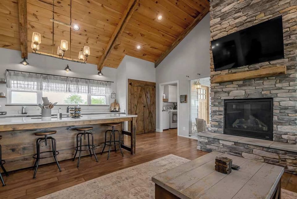 This open-concept space brings everyone together, from cooking in the kitchen to relaxing in the living room, all without missing a moment.