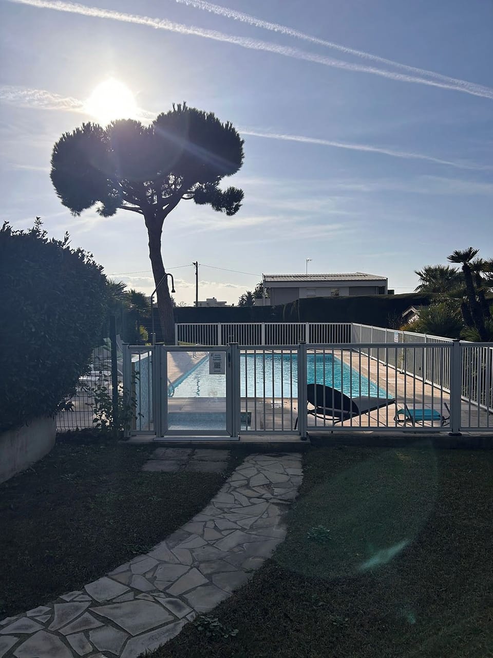 The building's pool with sunbeds