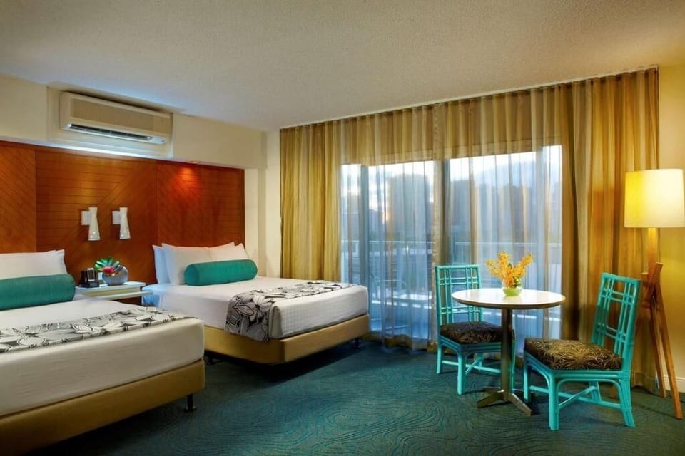 Settle into a spacious double room with cozy lounge nook.