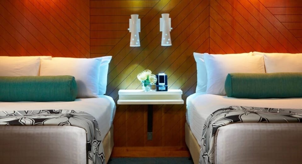 Drift off between plush pillows and warm, modern headboards.