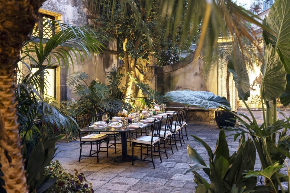The leafy al fresco dining area in the first part of the secluded courtyard.