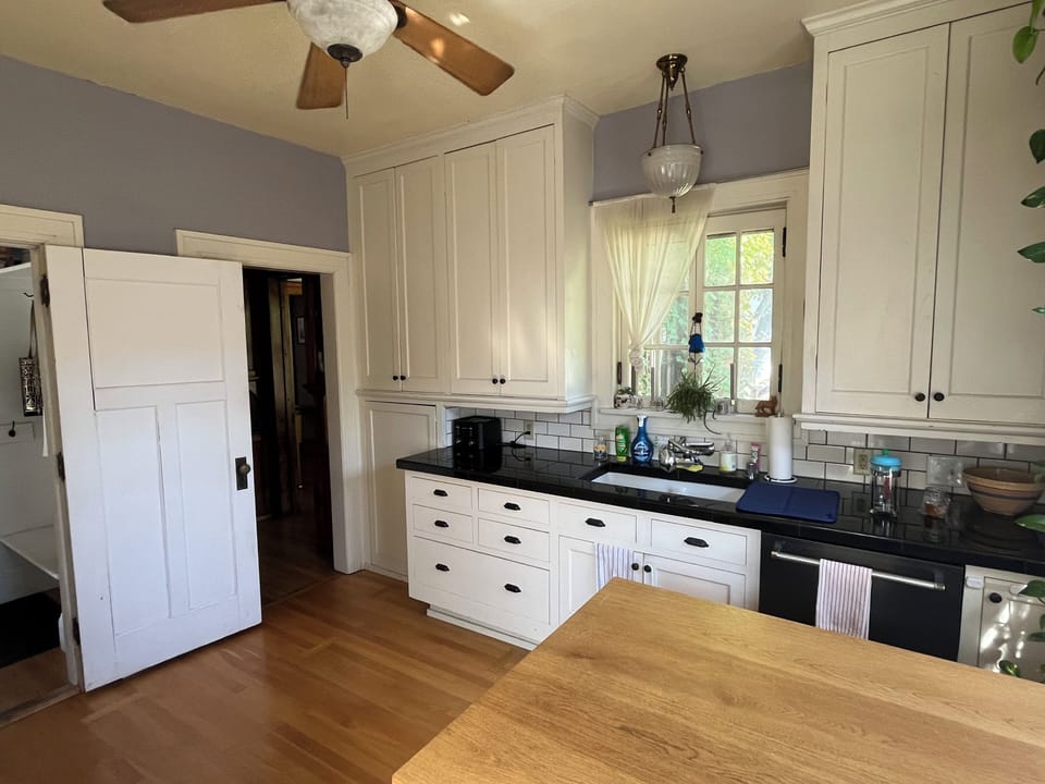 Sunny kitchen with island to dine, gas range, dishwasher, microwave, coffee!
