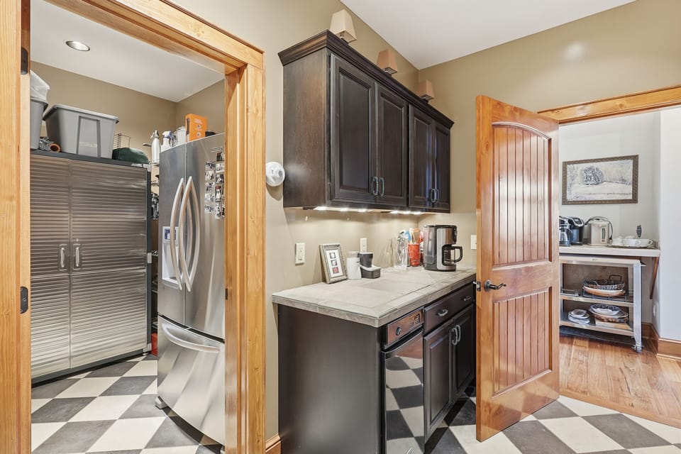 Step into a refined prep kitchen designed for seamless entertaining. Custom cabinetry, premium finishes, and thoughtful layout elevate every detail, making even simple moments feel polished and effortless.