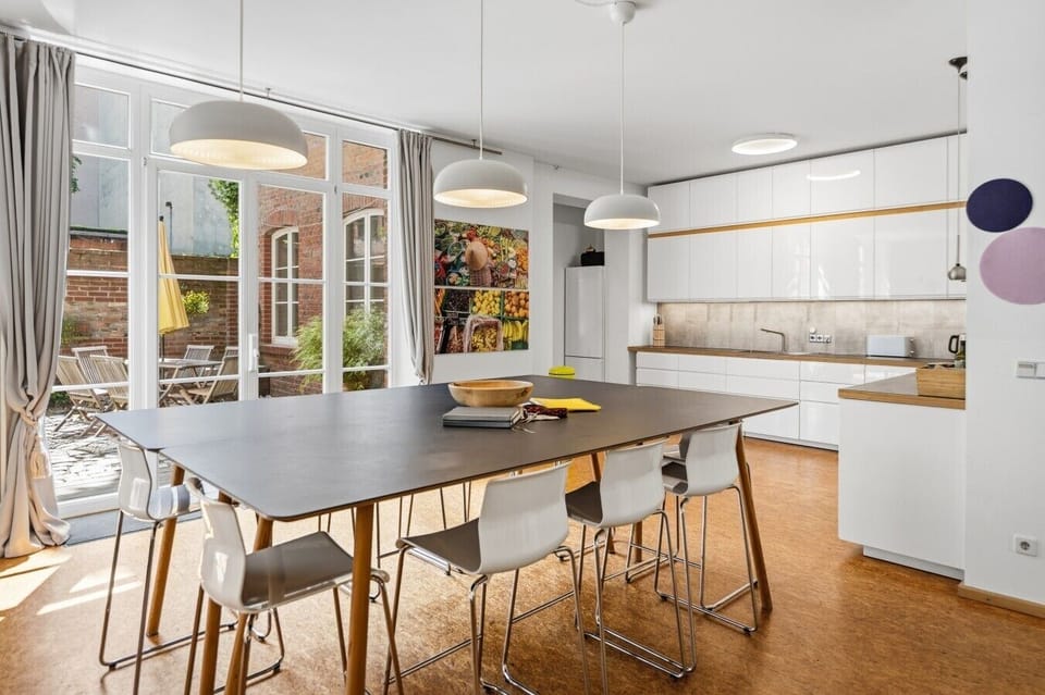Dining area with view of kitchen and patio