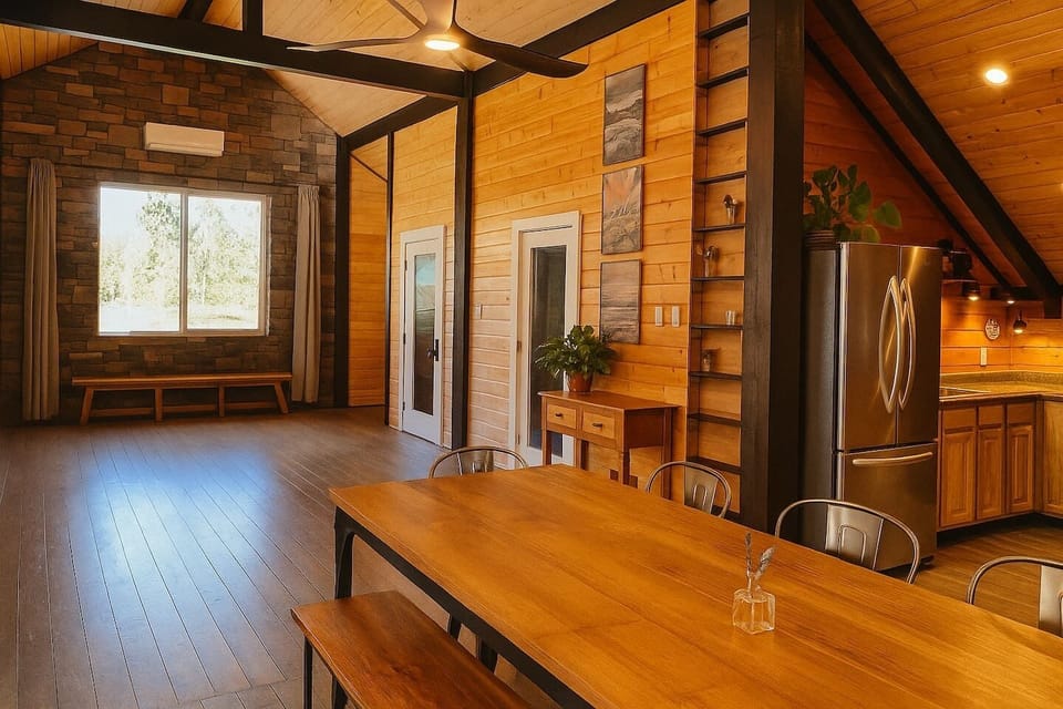 Gather in a bright, open space where rustic wood and modern comfort come together, perfect for family meals or group getaways.
