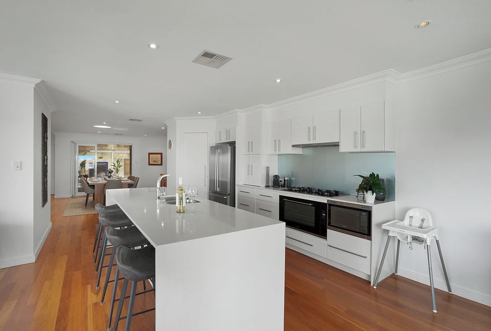 Spacious modern fully equipped kitchen with large island seating—ideal for cooking and dining