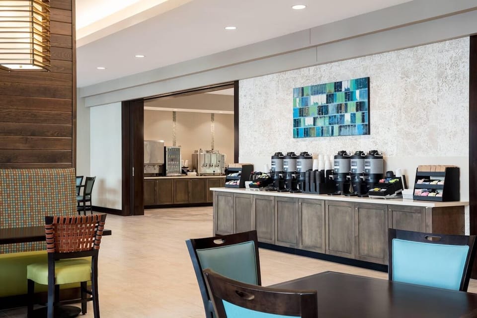 Start your morning with fresh coffee in a bright lobby.