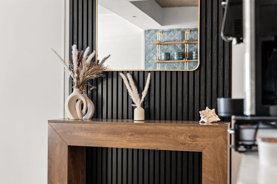 A convenient reception table and large mirror for your way in or out!