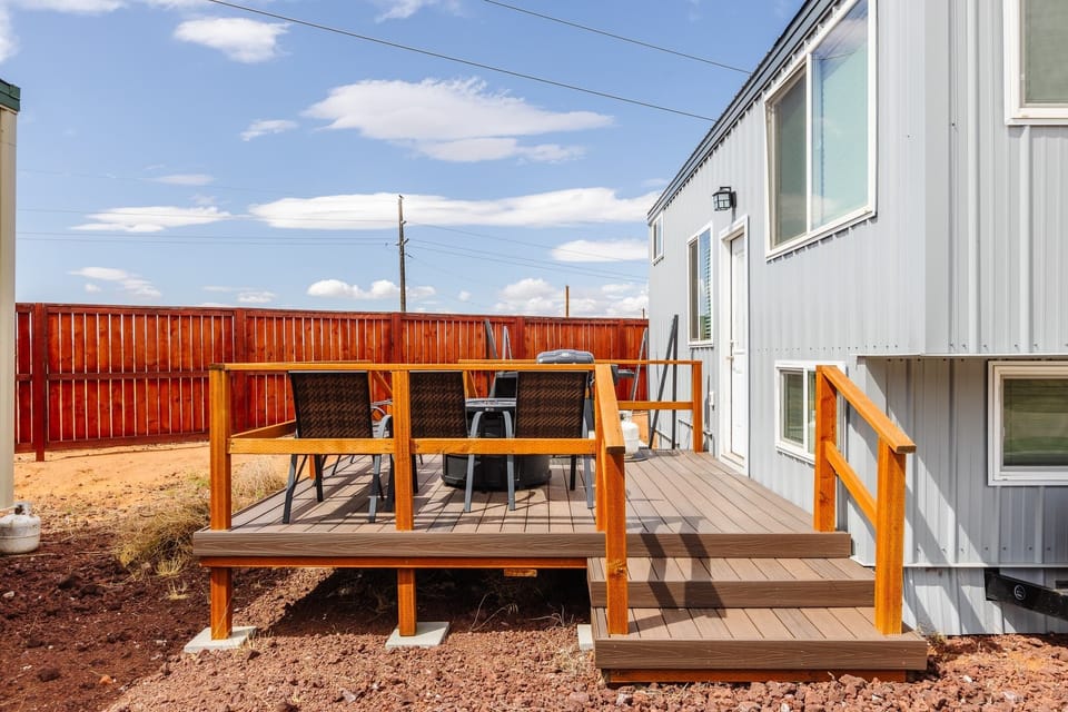 Relax on the spacious outdoor deck featuring a BBQ grill and a cozy fire pit with outdoor seating. Take in the beautiful mountain view as you cook, relax, and unwind in this inviting space, perfect for gatherings and enjoying the fresh air.