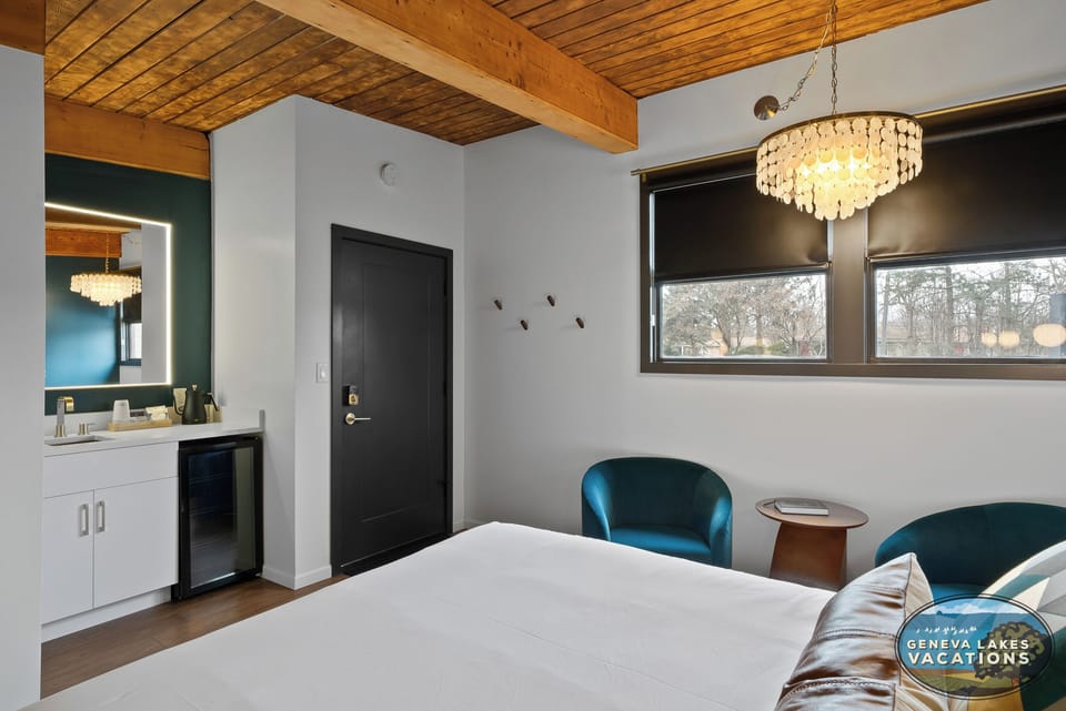 Entrance to room, spacious room with 2 queen beds, smart TV, dressing area, mini frig