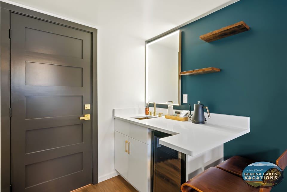 Adjustable brightness LED mirror. Coffee and tea amenities are provided with mini fridge.