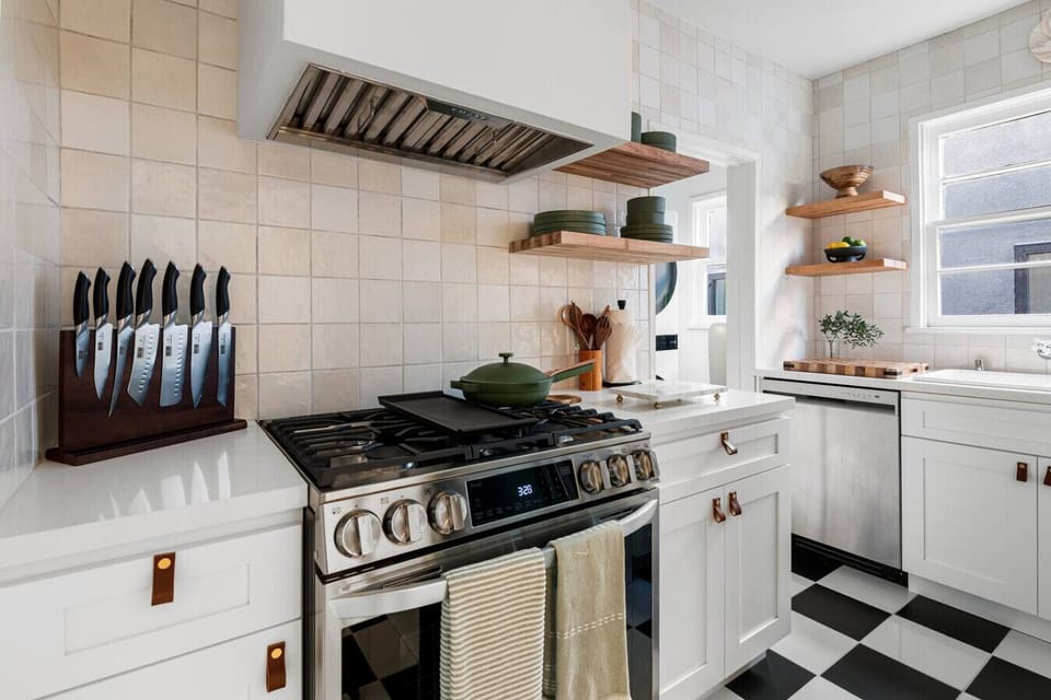 Thoughtfully stocked kitchen with utensils, cookware, and basics for your convenience.