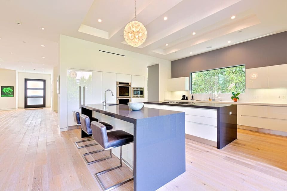 Sleek, modern kitchen with spacious countertops, fully equipped for daily cooking or entertaining