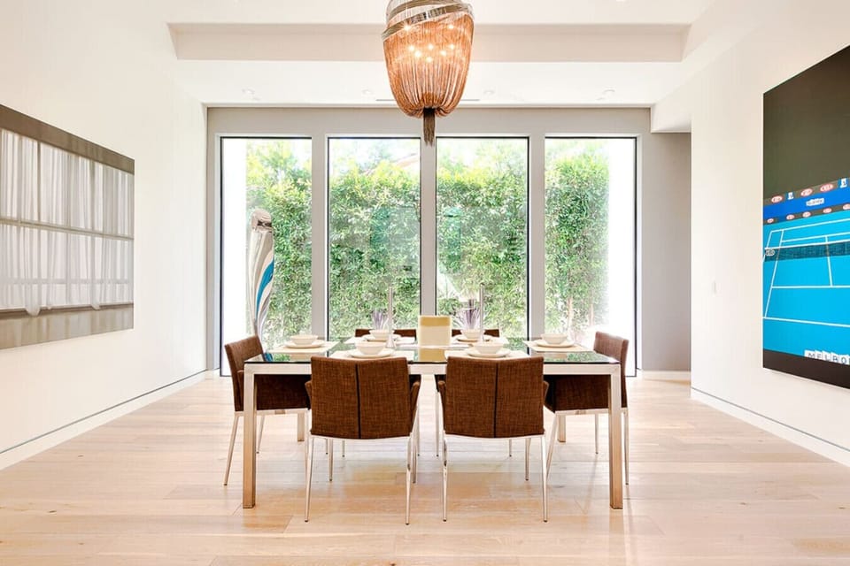 Classy dining area with seating for six, seamlessly connected to the kitchen and living space.