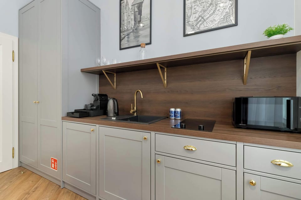 Compact kitchenette with upper cabinets.