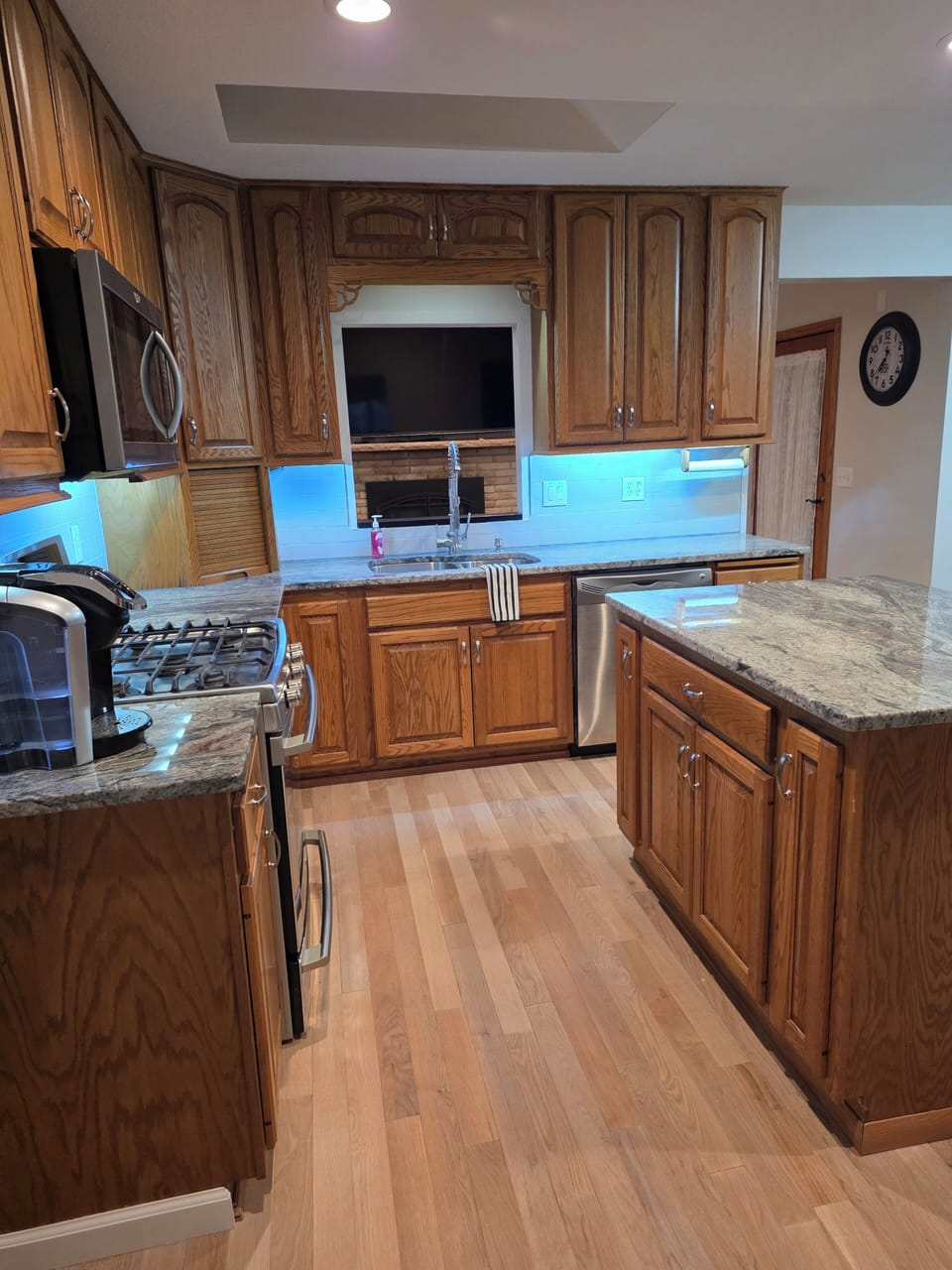 Kitchen with stove, microwave, dishwasher, microwave,toaster. Washer & dryer.
