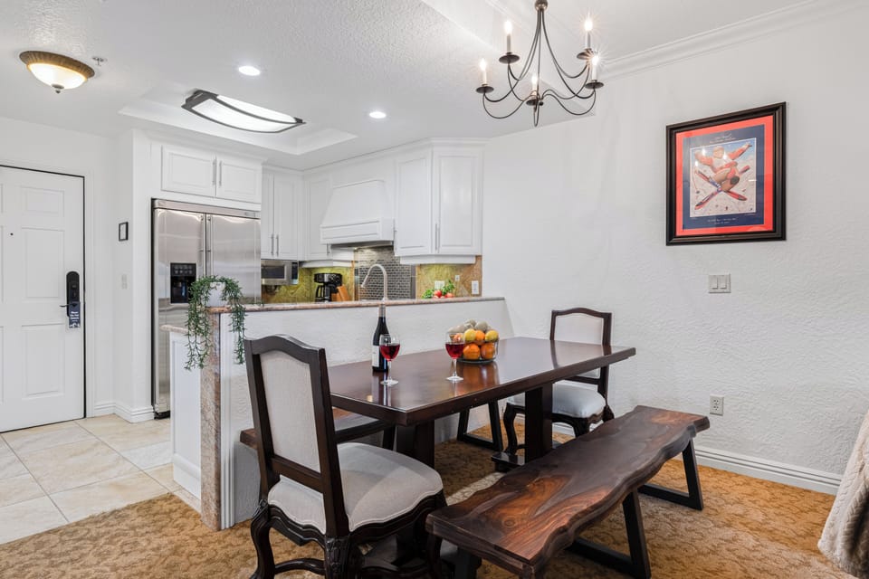 Dining area featuring a rustic wooden table and bench seating.