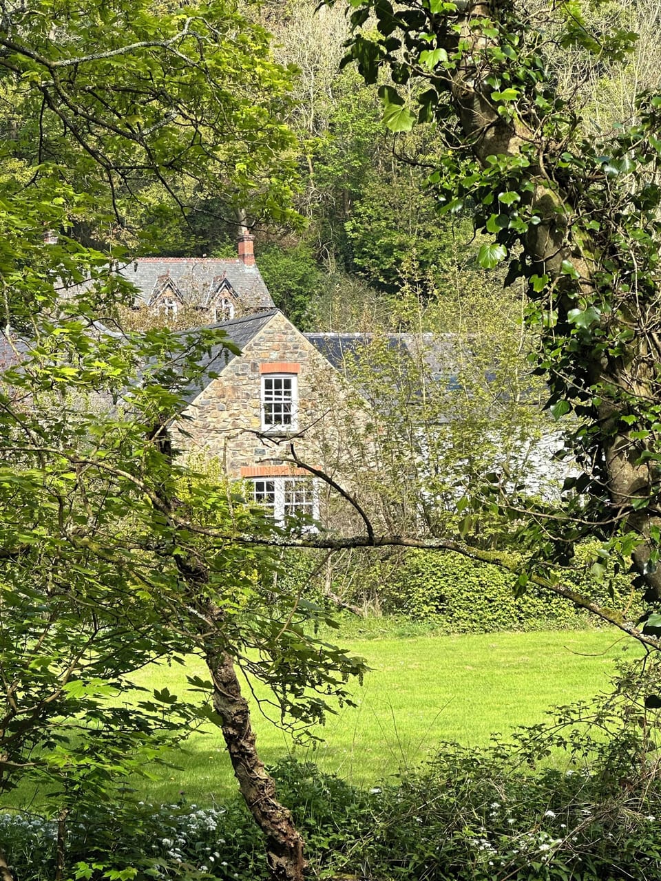 View from the river back to the original Pump  house at the Mill.