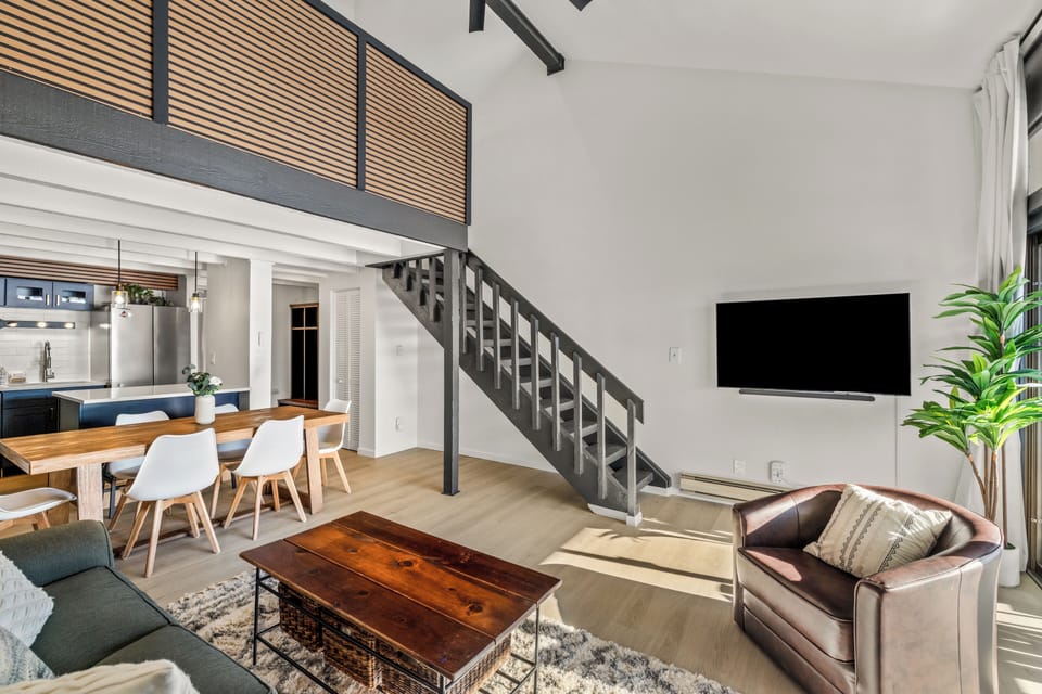 Step into your stylish loft with soaring ceilings, modern furnishings, and an open layout perfect for relaxing or entertaining.