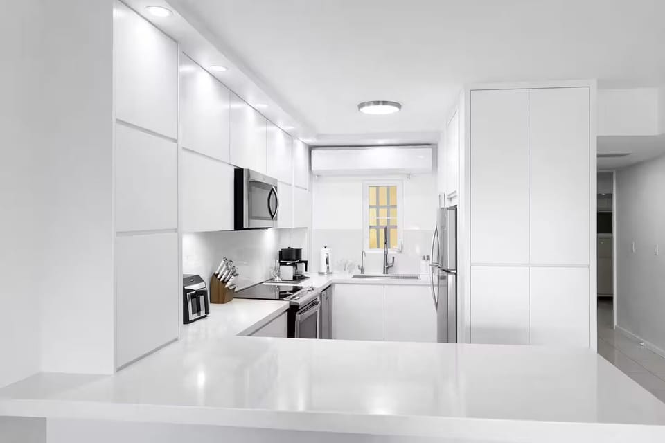 Sleek modern kitchen fully stocked for effortless island living.