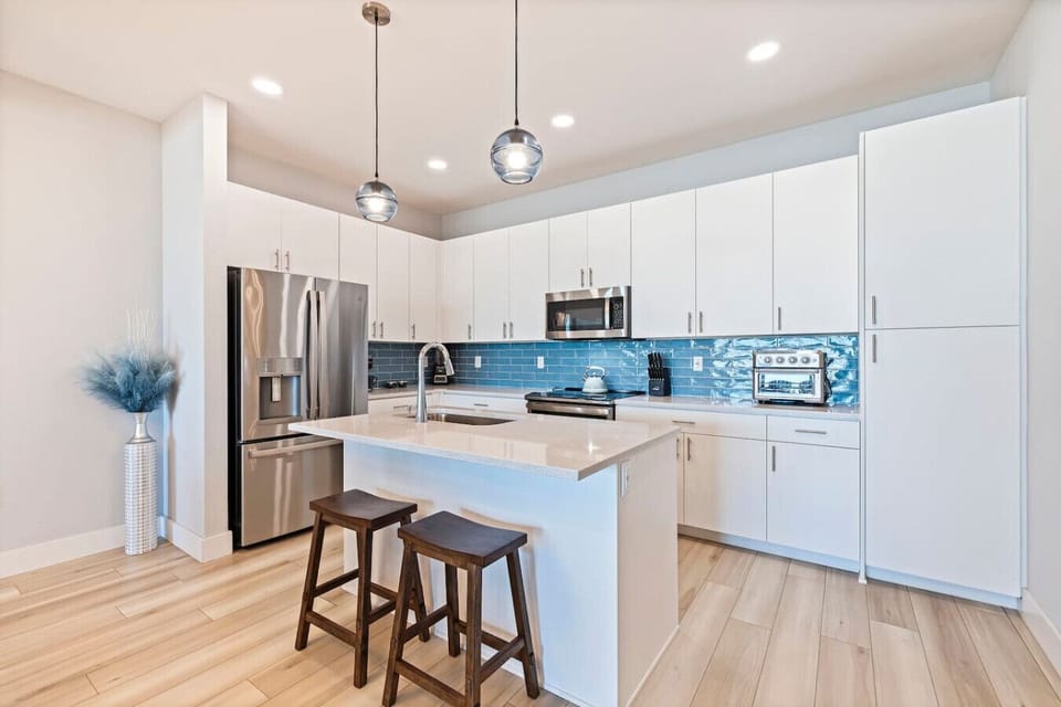 Cook up beach-day meals in a fully equipped kitchen with island seating.