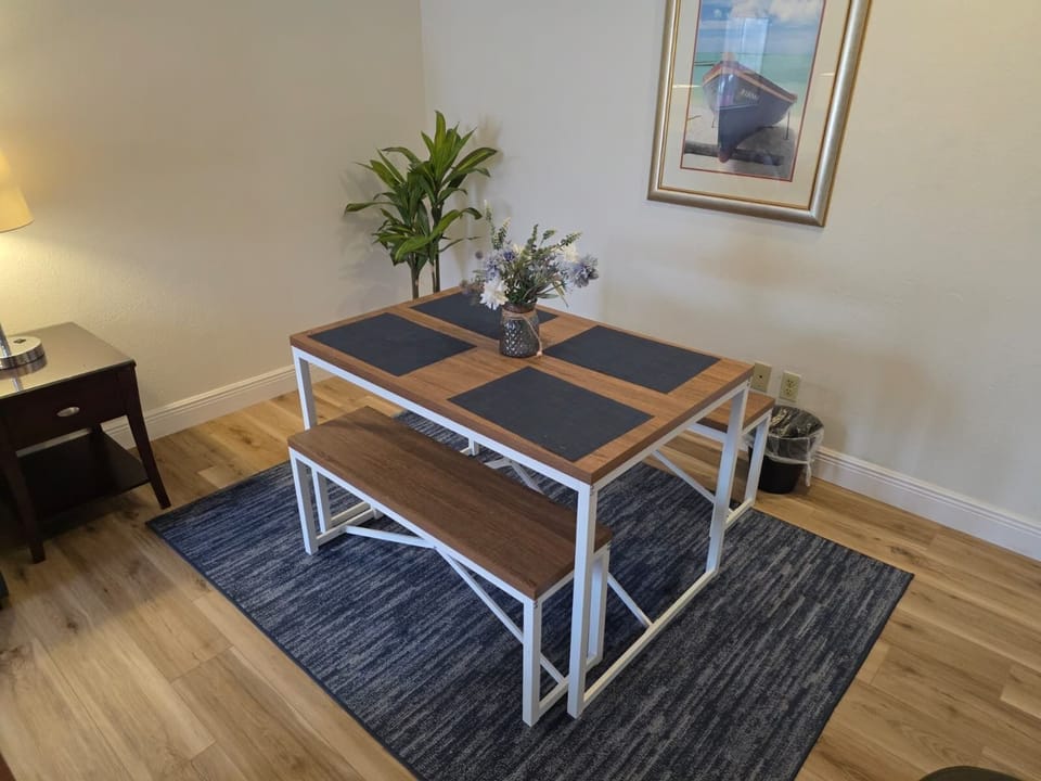 Bright and welcoming table for four—perfect for meals or game nights.